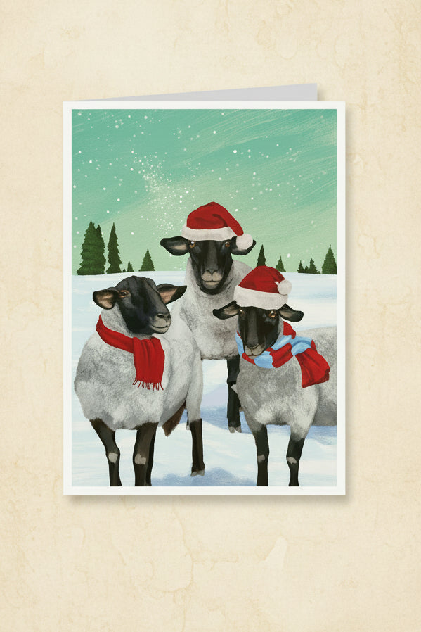 Card with goats wearing Santa hats and scarves on a snowy background